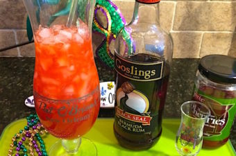 Hurricane cocktail is a fruity passion fruit and rum drink. Invented in New Orleans, it's a great Mardi Gras libation!